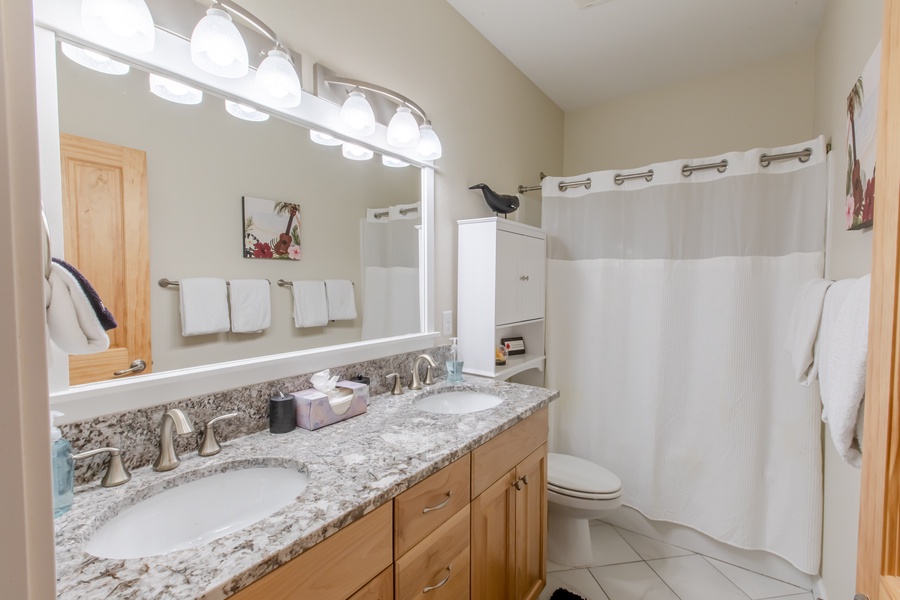 Enjoy the convenience of the double sinks in the shared full bathroom
