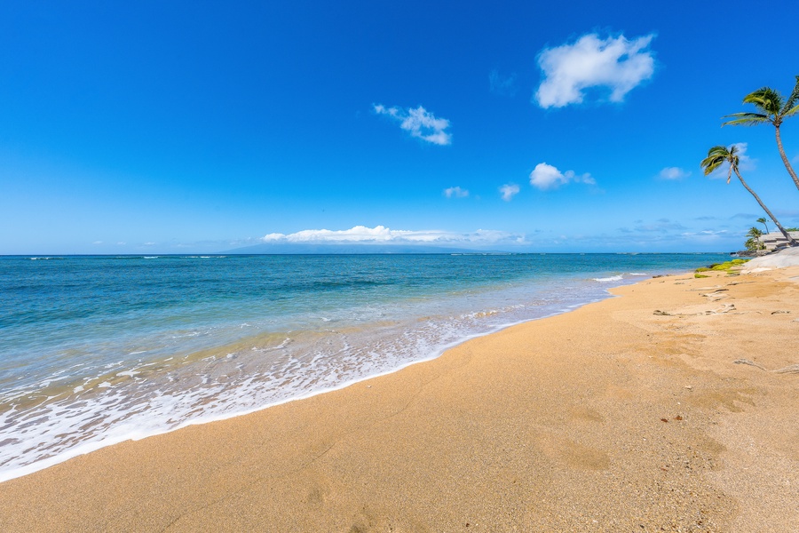Golden sand and endless blue water await steps from Royal Kahana 308.