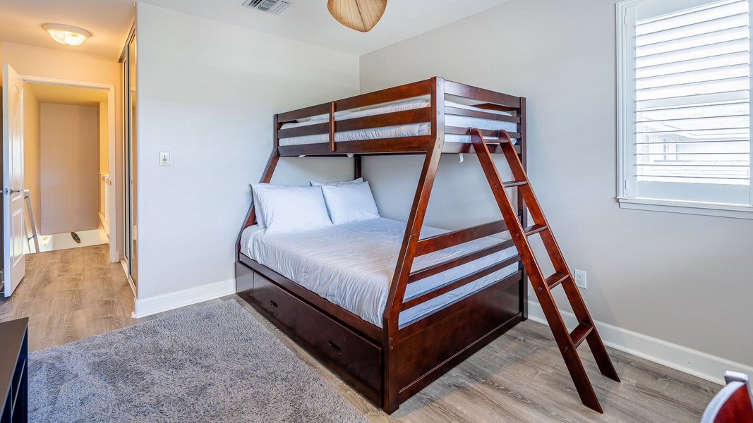 The third guest bedroom with a twin over a full bunk bed.