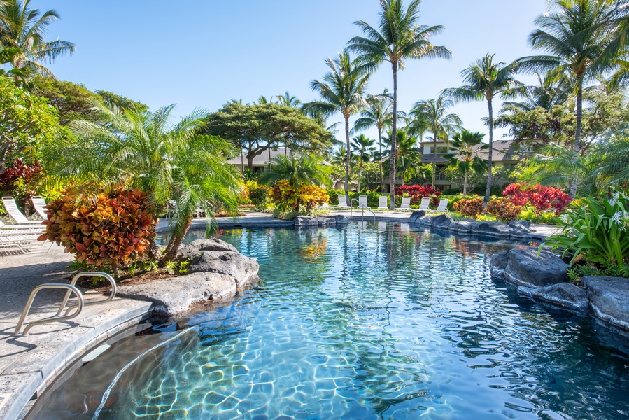 Palm Villas Beautiful & Inviting Lagoon Style Swimming Pool, Jacuzzi and Waterfall, Surrounded by Lush Landscaping