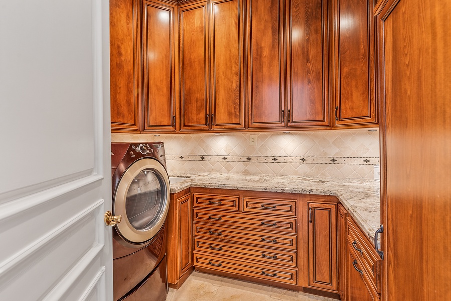 A dedicated laundry space with a washer/dryer