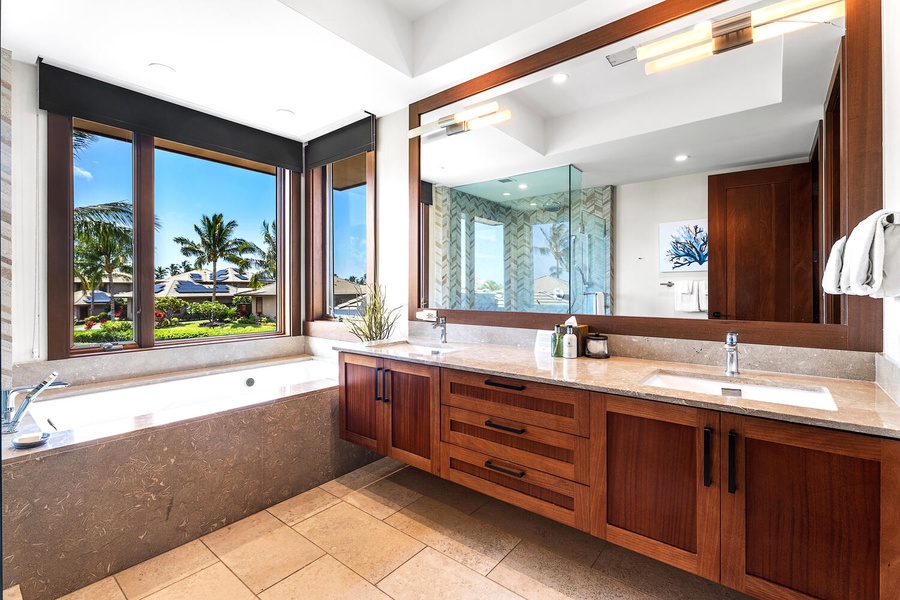 Elegant double vanity and ample storage complete the primary ensuite.
