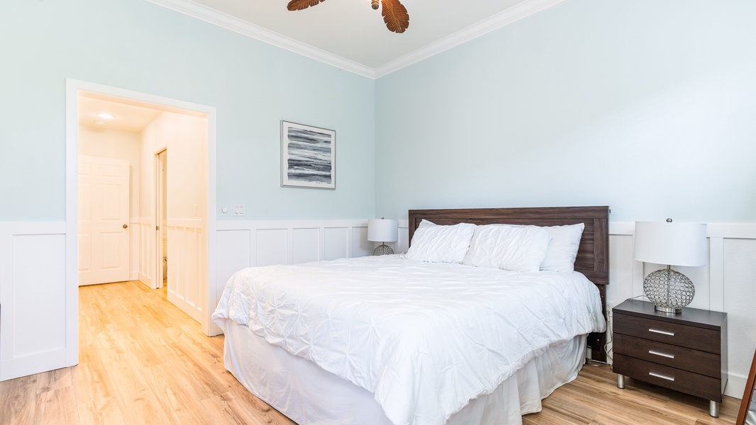 The primary guest bedroom is comfortable and spacious for a restful slumber.