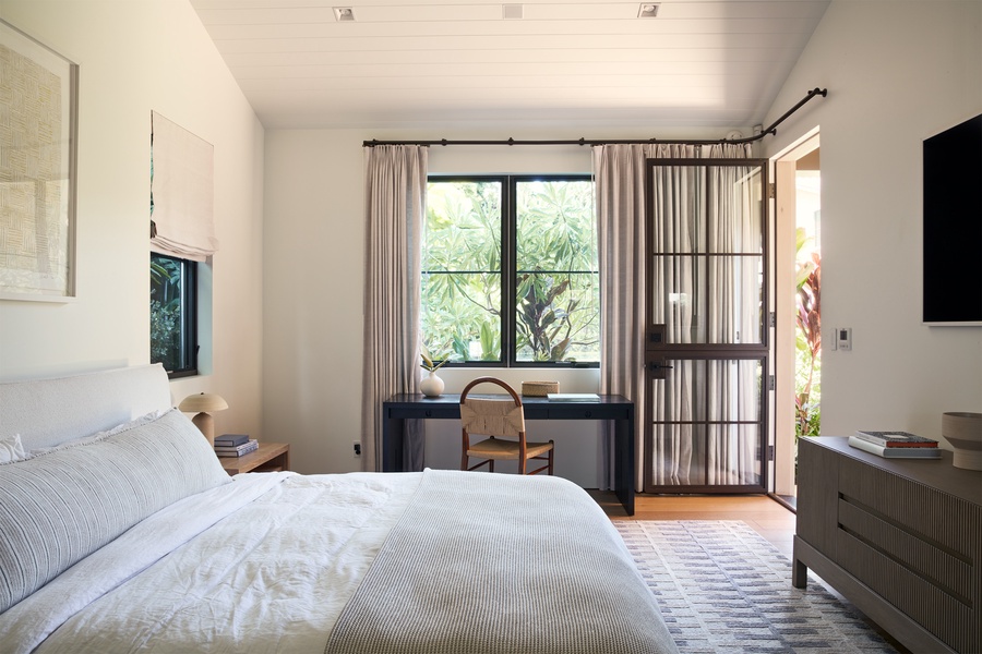 Wake to tropical garden views and gentle island light in this serene bedroom retreat, thoughtfully designed for rest and relaxation.