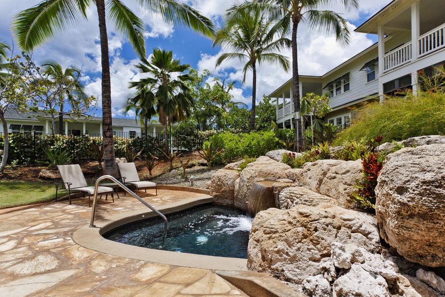 Soak in the hot tub in the center of the palm fringed landscape.