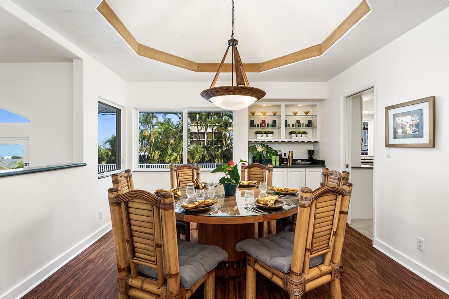 Gather around this elegant dining table for memorable meals with tropical views framing your conversations.