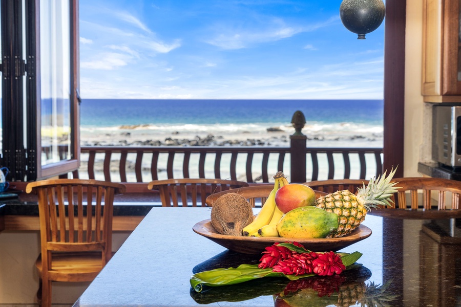 Start your day with fresh fruit and waves—oceanfront breakfast settings don’t get better than this.