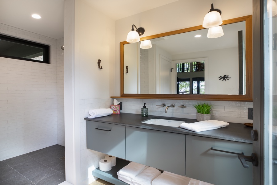 Sleek double vanity with a spacious countertop and soft lighting.