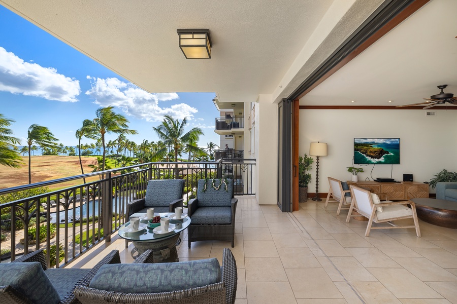Relax on your private balcony with stunning tropical views, then step inside to unwind in your elegant living space.