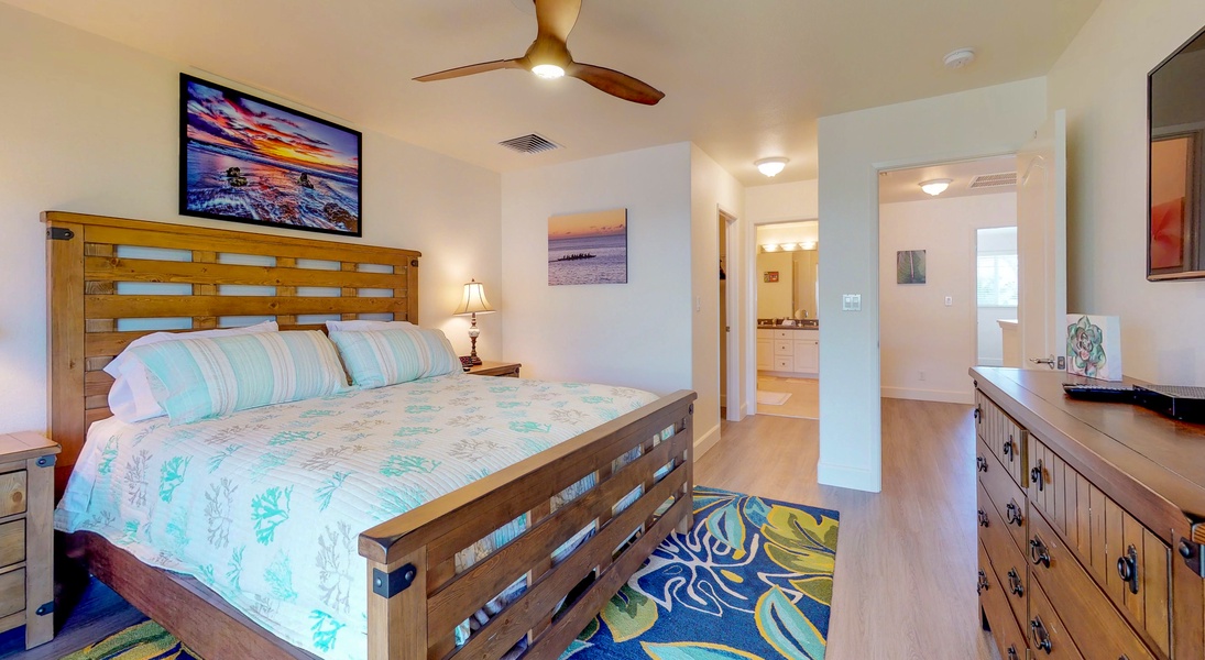 The upstairs primary guest bedroom with access to a private lanai.