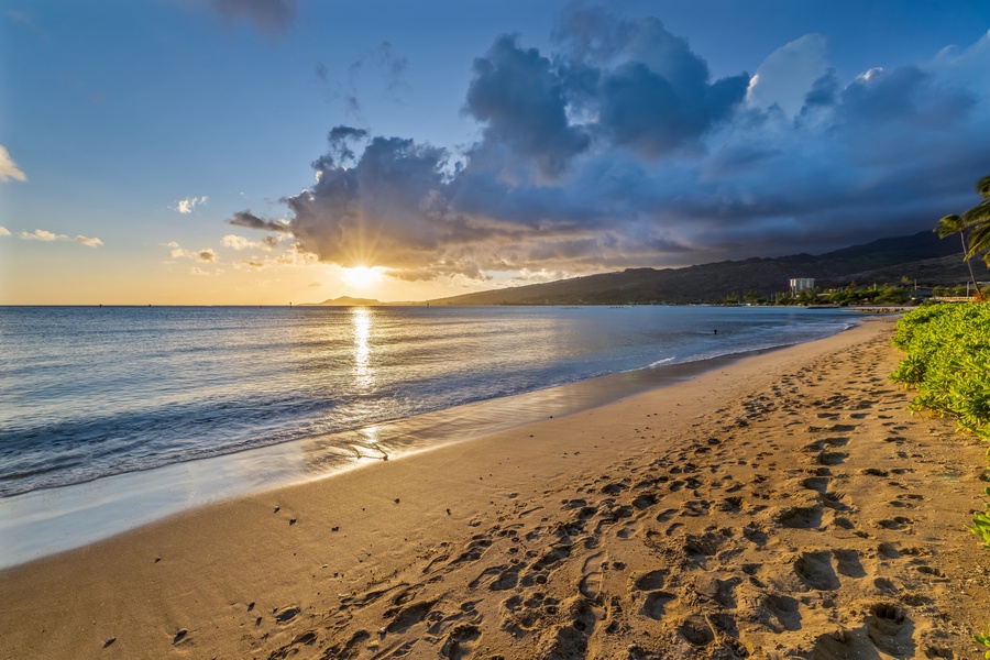 Stroll through the sandy beach at sunset.