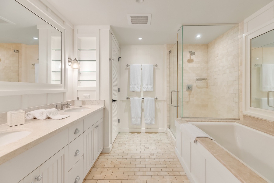 Venture into the primary bath for a mesmerizing soak in the large, relaxing tub, or enjoy the separate shower