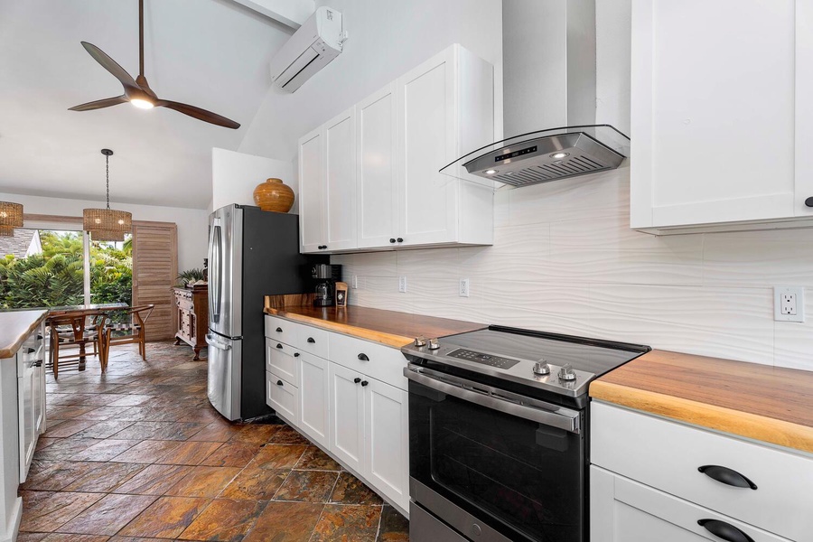 The fully-equipped kitchen has stainless steel appliances and plenty of storage spaces.