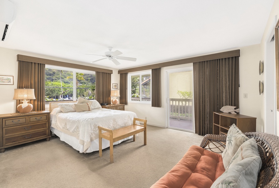 Primary guest suite on the lower-level with a queen bed and private lanai.