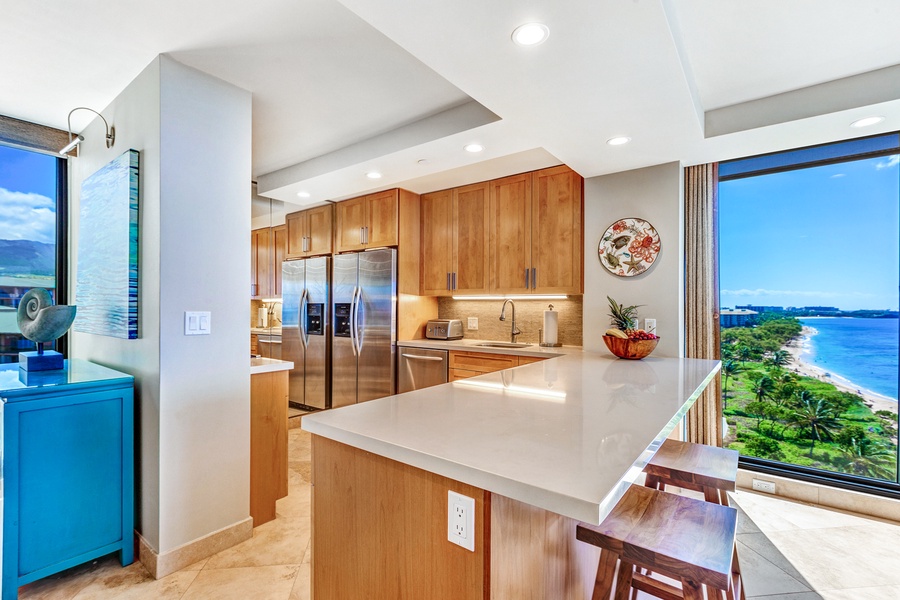 The kitchen bar with seating for two, perfect for quick meals and entertainment.