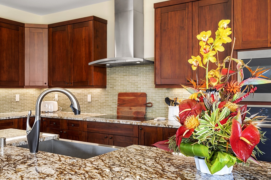 Kitchen with wide granite countertops.