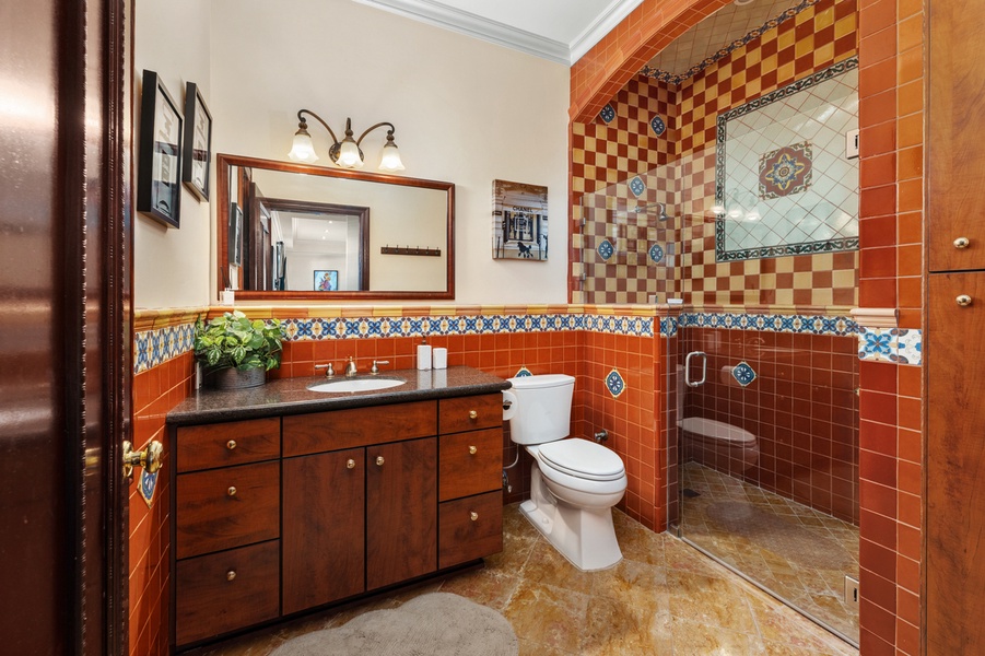 A patterned tile accent adds a distinctive touch of character to this inviting ensuite.