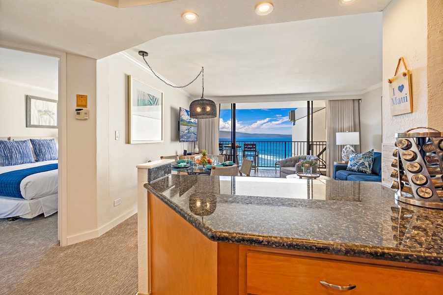 The kitchen's granite breakfast bar is perfect for quick snacks or enjoying a drink