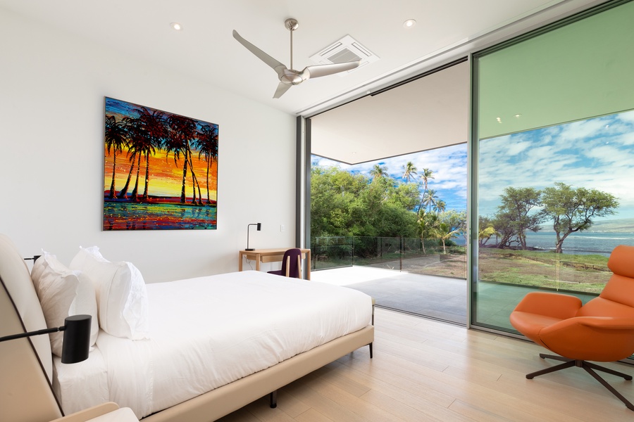 Bedroom 5 features sleek design and expansive sliding doors opening to the serene outdoor view