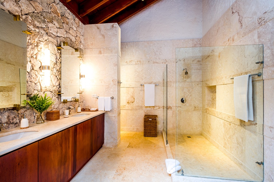 Spacious ensuite bathroom with a walk-in shower and elegant design.