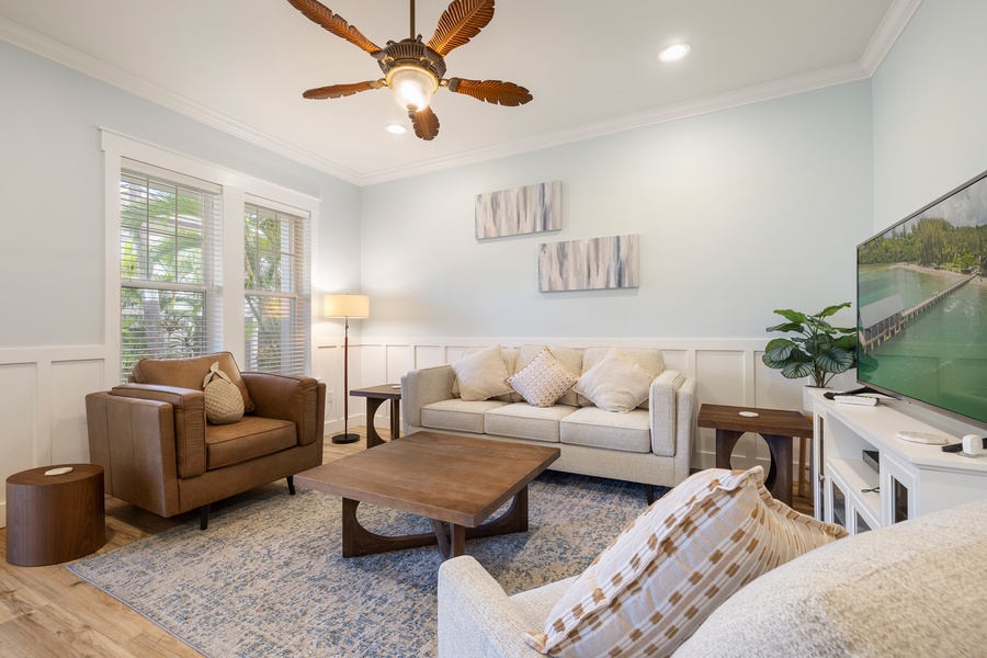 Tropical elegance meets modern comfort in this beautifully designed living space with plenty of seating.