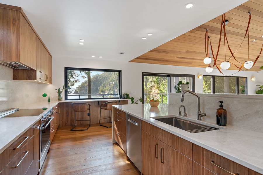 The spacious kitchen featuring ample cabinetry for extra storage.