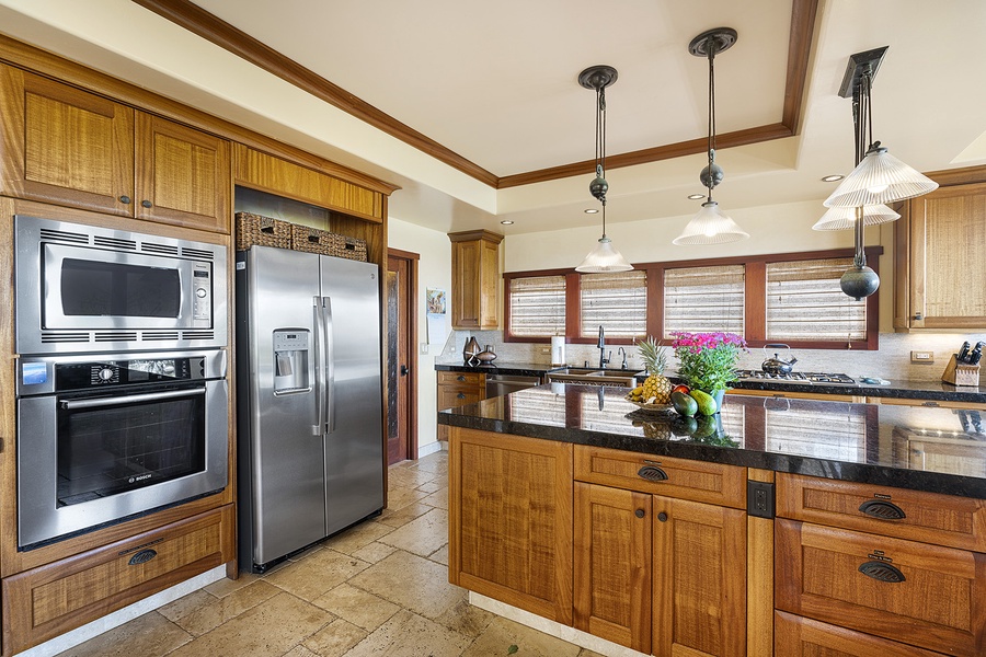 Kitchen features a wine fridge and gas range
