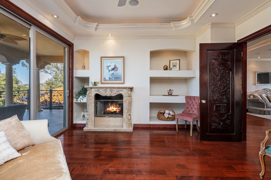 The fireplace and built-in shelves make this the corner that fills up on cool evenings.