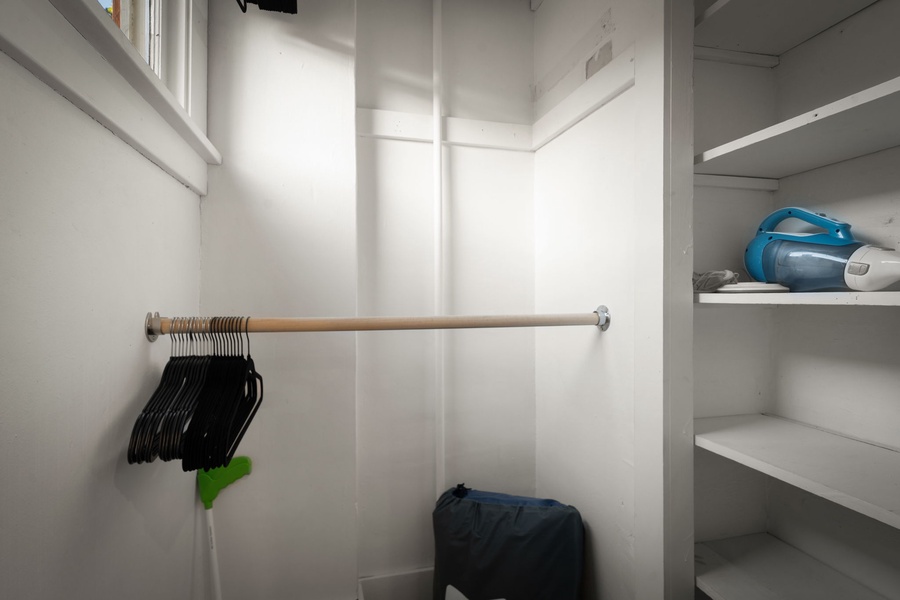 Organize your stay with built-in shelving and hanging space for travel essentials.