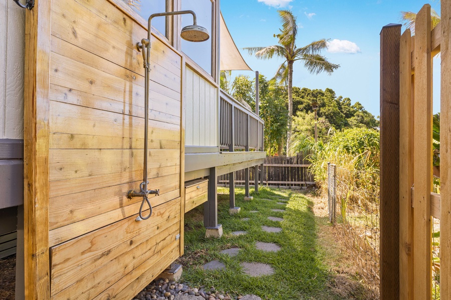 Rinse off the sand under the private outdoor shower, complete with island vibes and garden views.