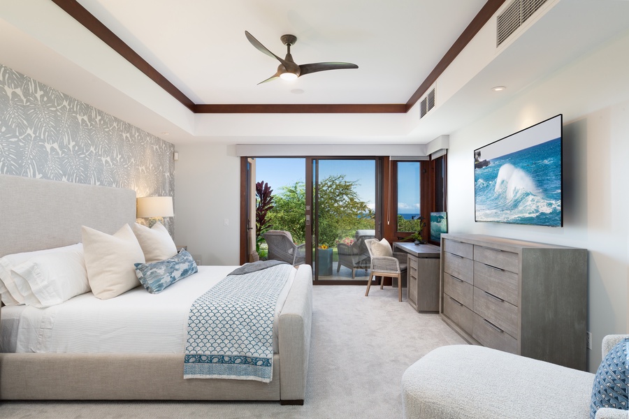 Primary Suite with ocean view deck, king size bed and large flat screen TV