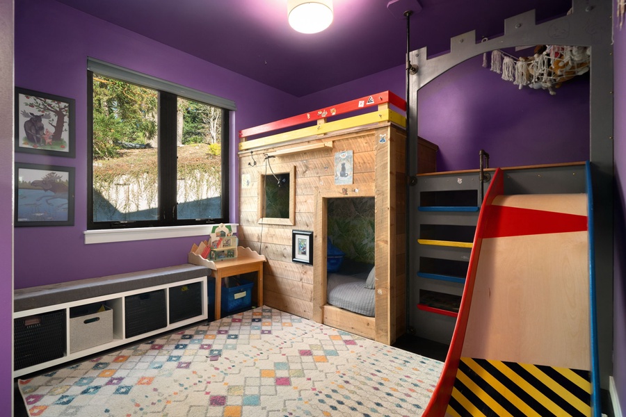 Your kids will love this magical playroom with a castle bunk bed, colorful slides, and plenty of space for adventures and imagination to run wild.