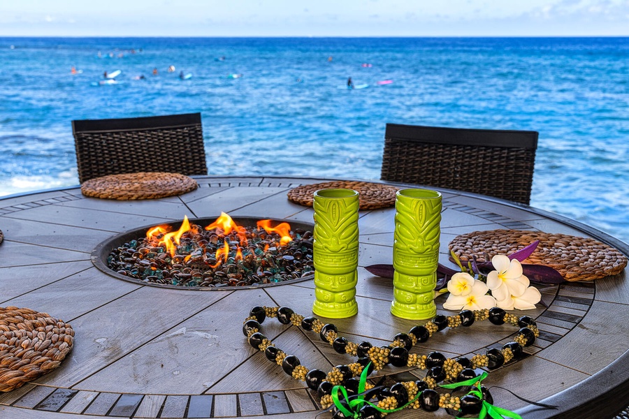 Gather around the fire pit with drinks and enjoy the ocean breeze under the Hawaiian sky.