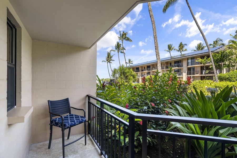 Additional seating and tropical lush landscape