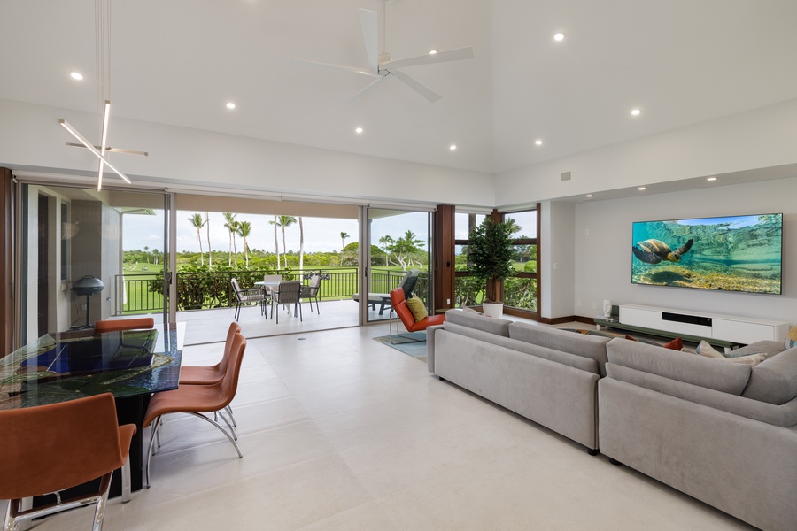 Effortless indoor-outdoor living with a seamless connection from the kitchen, dining, and living areas to the lanai.