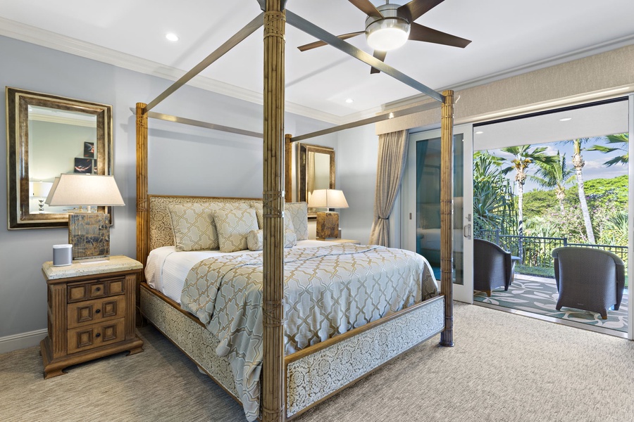 Retreat in the primary suite featuring a king-sized bed and private lanai.