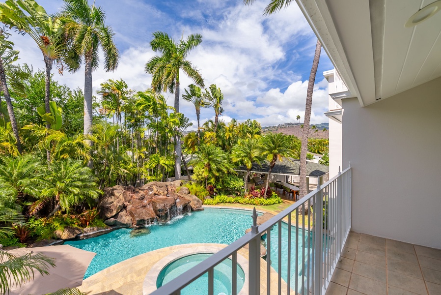 Private balcony with a view of the tropical pool and garden, perfect for soaking in the relaxing atmosphere.