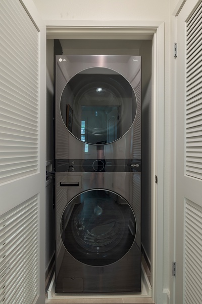 Your laundry needs are handled with this sleek stacked washer and dryer tucked neatly in its own closet space.