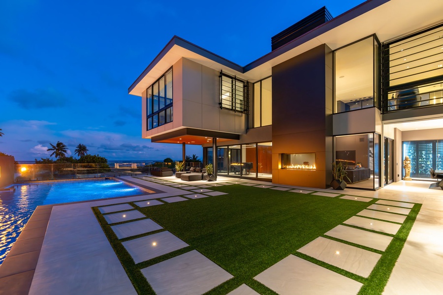 A final look at the villa’s grand exterior, glowing with warm light—inviting you home after a day in paradise.