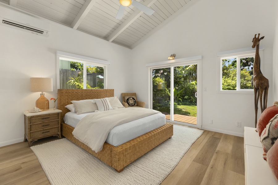Primary bedroom with private access  to main lanai and garden area, Split A/C, and access too Outdoor Shower.