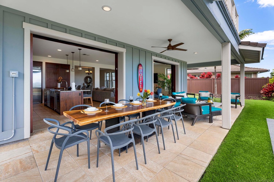 Host memorable gatherings in this open and inviting outdoor dining space, seamlessly connected to the kitchen for ultimate convenience and style.