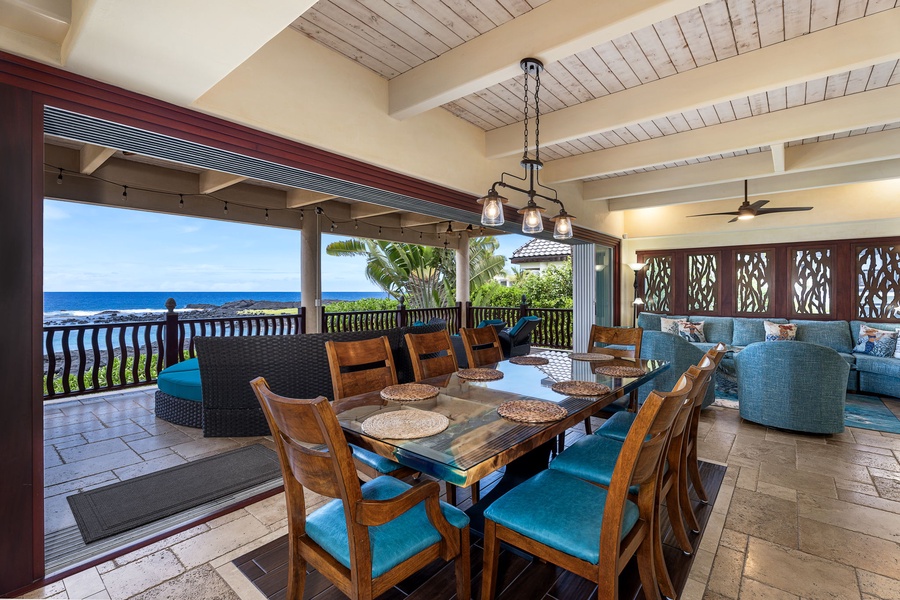 Dining area with seating for 10 and expansive ocean views—enjoy alfresco-style meals from indoors.
