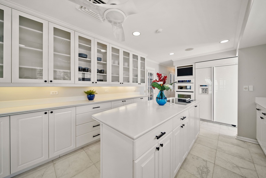 Wide countertops and a spacious island cooktop provide the perfect setup for preparing island-style meals.