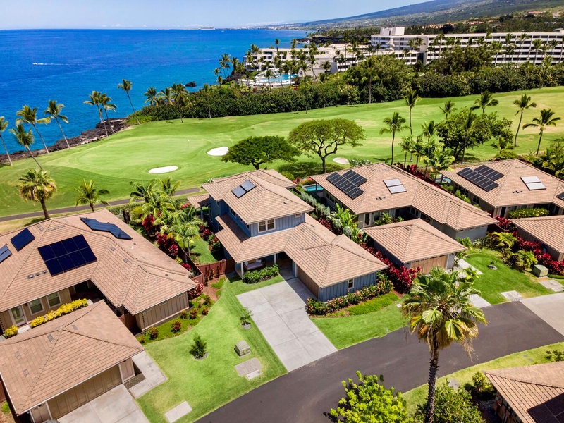 Aerial view of Holua Kai #26 and the lush residential area.