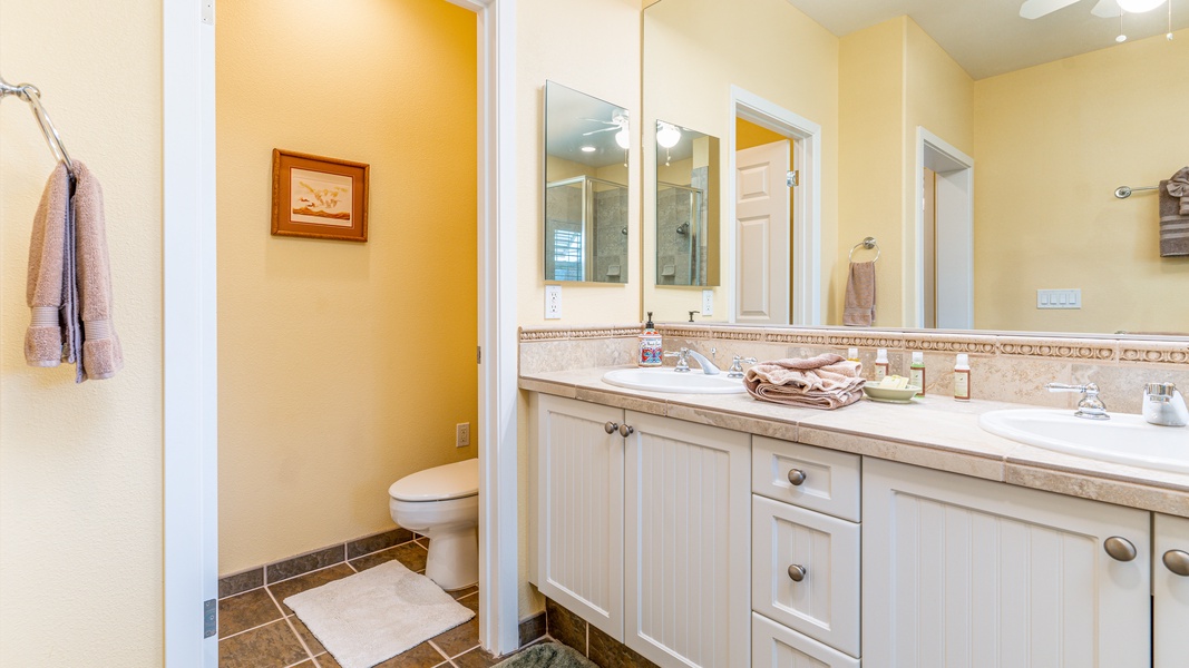 The third guest bathroom with a shower and tub combo.