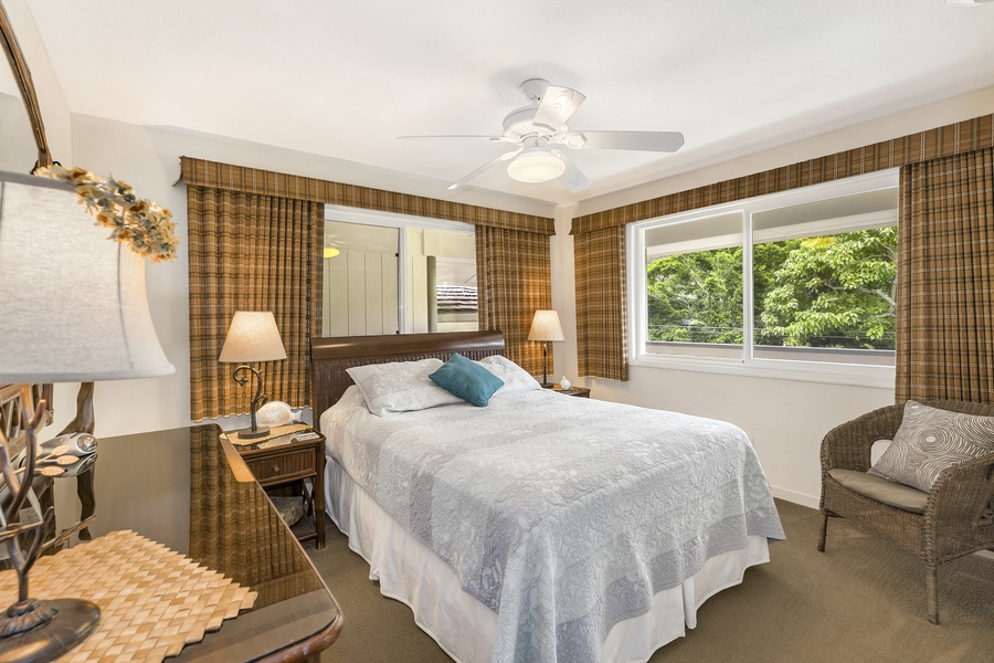 Bright and airy guest suite three with large windows.