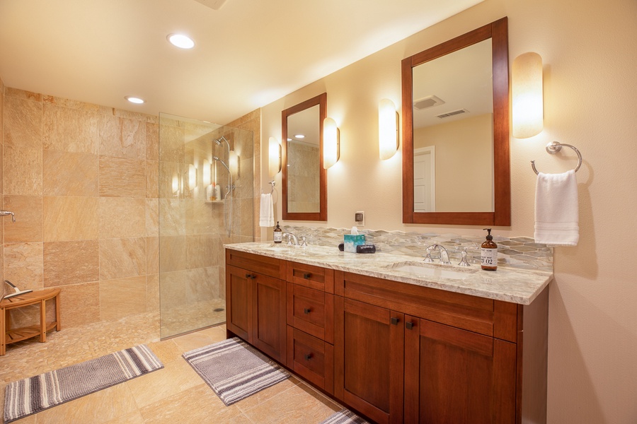 Spacious en-suite with walk in shower, double vanity, and soaking tub.