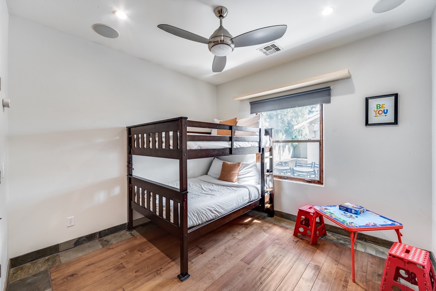 Kids room with bunk beds and toys