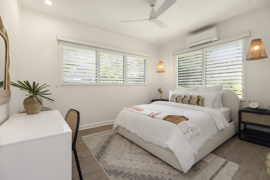 Guest bedroom with natural light and individual AC