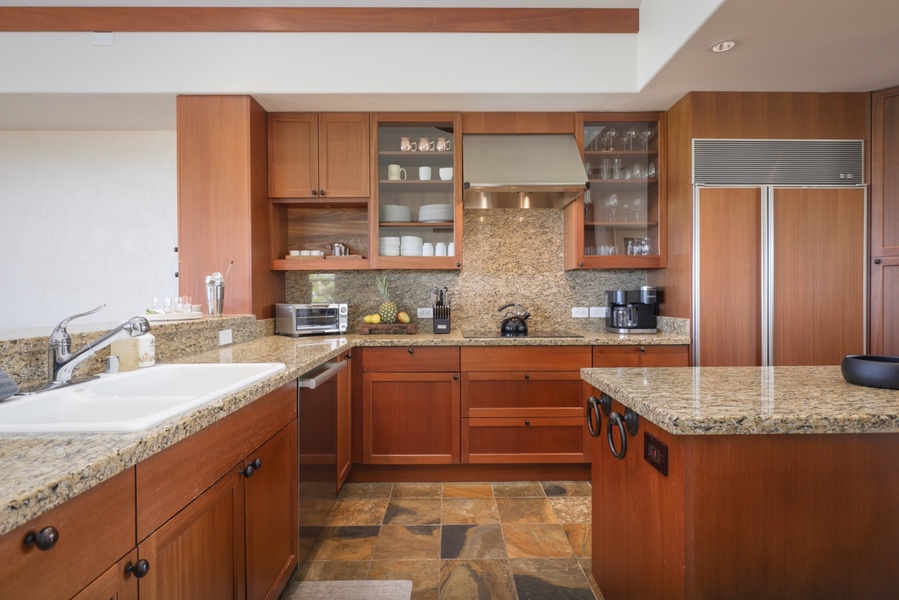 Ample counter space, top tier appliances and gleaming granite - a chef’s delight!
